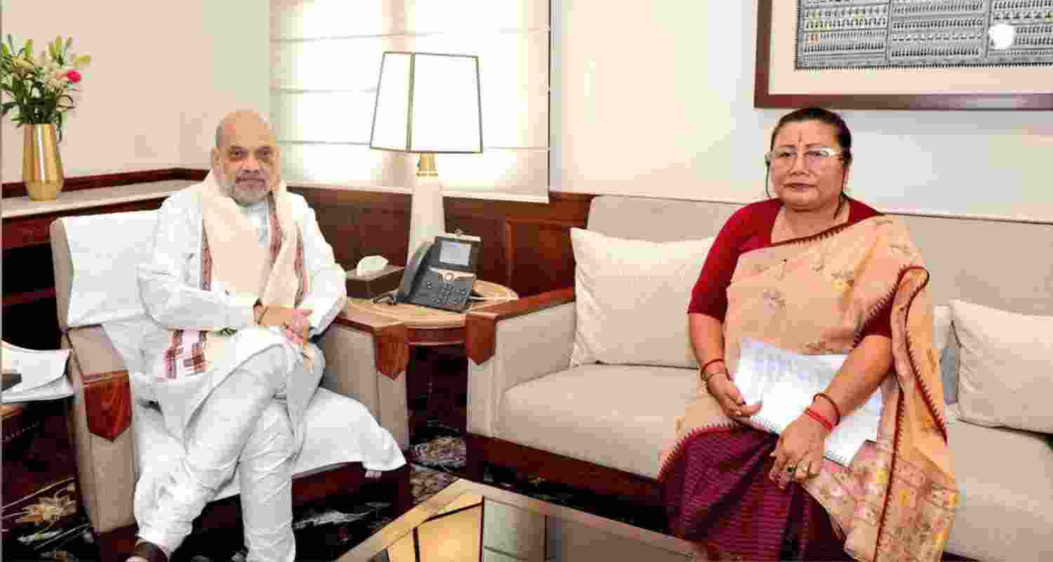 BJP's Manipur president A Sharda Devi (R) with Union Home Minister Amit Shah (L) in New Delhi on Thursday.