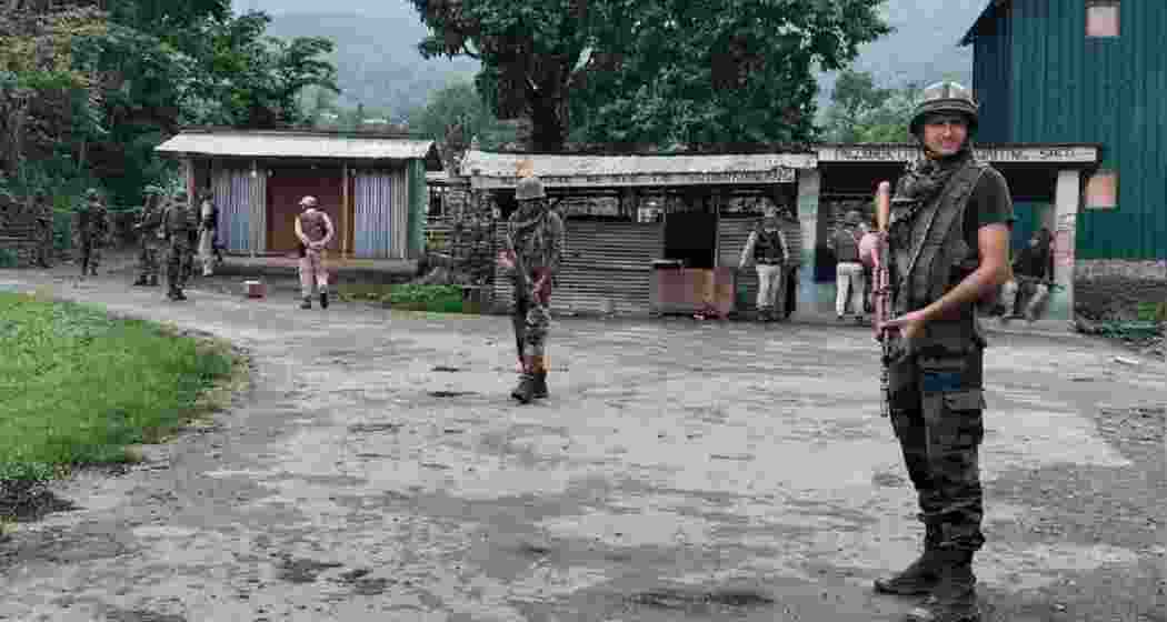 Security forces stand guard in Jiribhim, Manipur, amid escalating tensions.