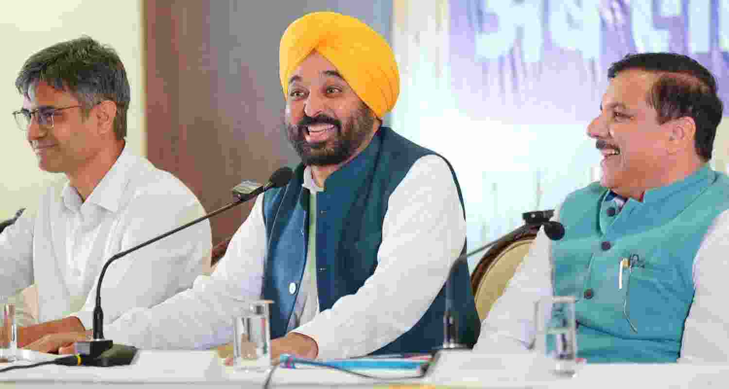 Punjab Chief Minister Bhagwant Mann along with AAP leaders Sanjay Singh and Sandeep Pathak addresses a press conference, in Chandigarh.