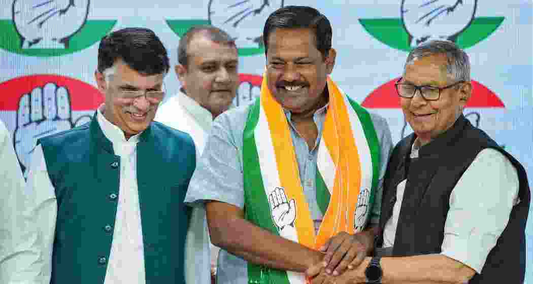 Lok Sabha MP Ajay Nishad joins Congress party in the presence of AICC Bihar in-charge Mohan Prakash and senior party leader Pawan Khera, in New Delhi on Tuesday. 