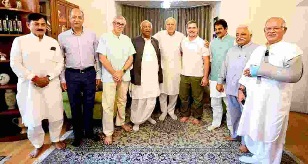 Congress leaders Rahul Gandhi and Mallikarjun Kharge meet with Farooq Abdullah at his residence in Srinagar during a recent visit, discussing key political strategies for the upcoming elections.