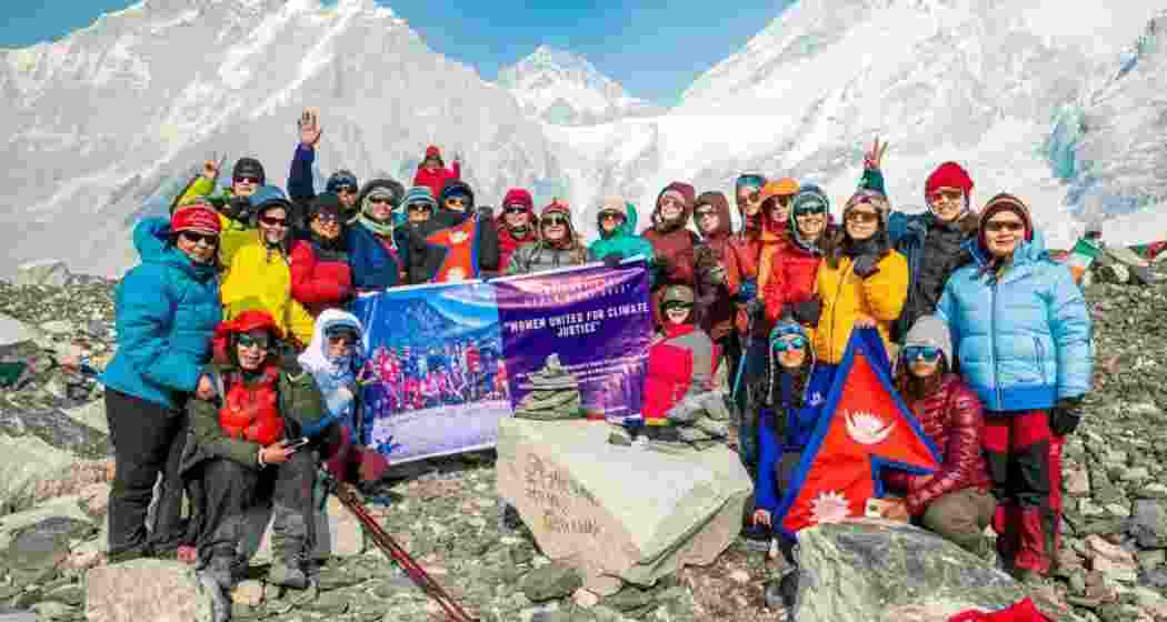 The team, comprising only women, gathers to pose for a photograph as they continue their trek to Mount Everest Base Camp.