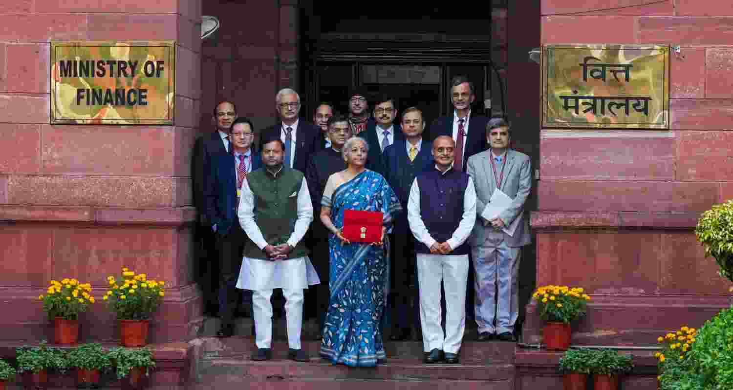 Finance minister Nirmala Sitharaman outside the finance ministry before presenting the budget with secretaries of the ministry, in New Delhi