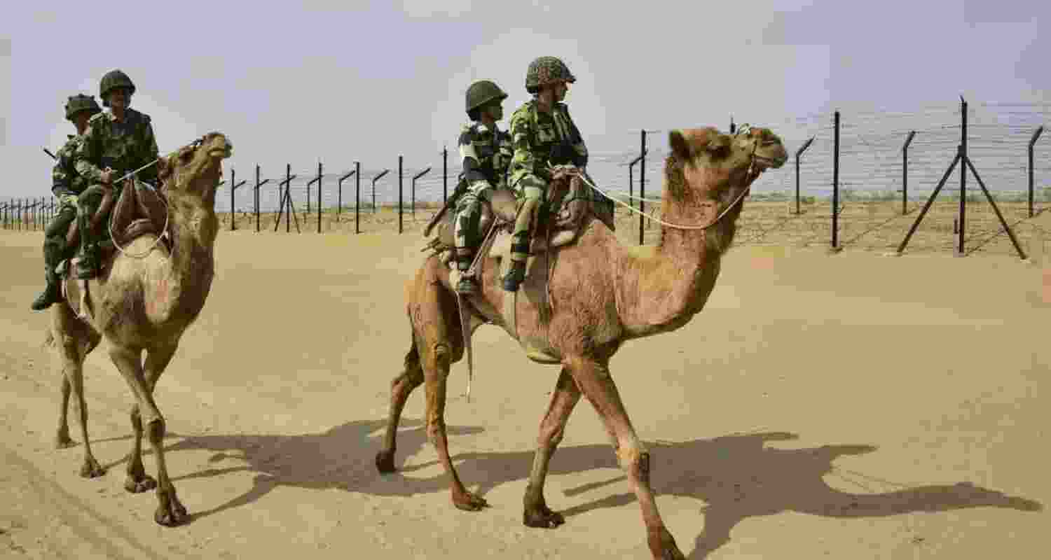 BSF jawans mounted on camels patrol the international border between India and Pakistan in Rajasthan.