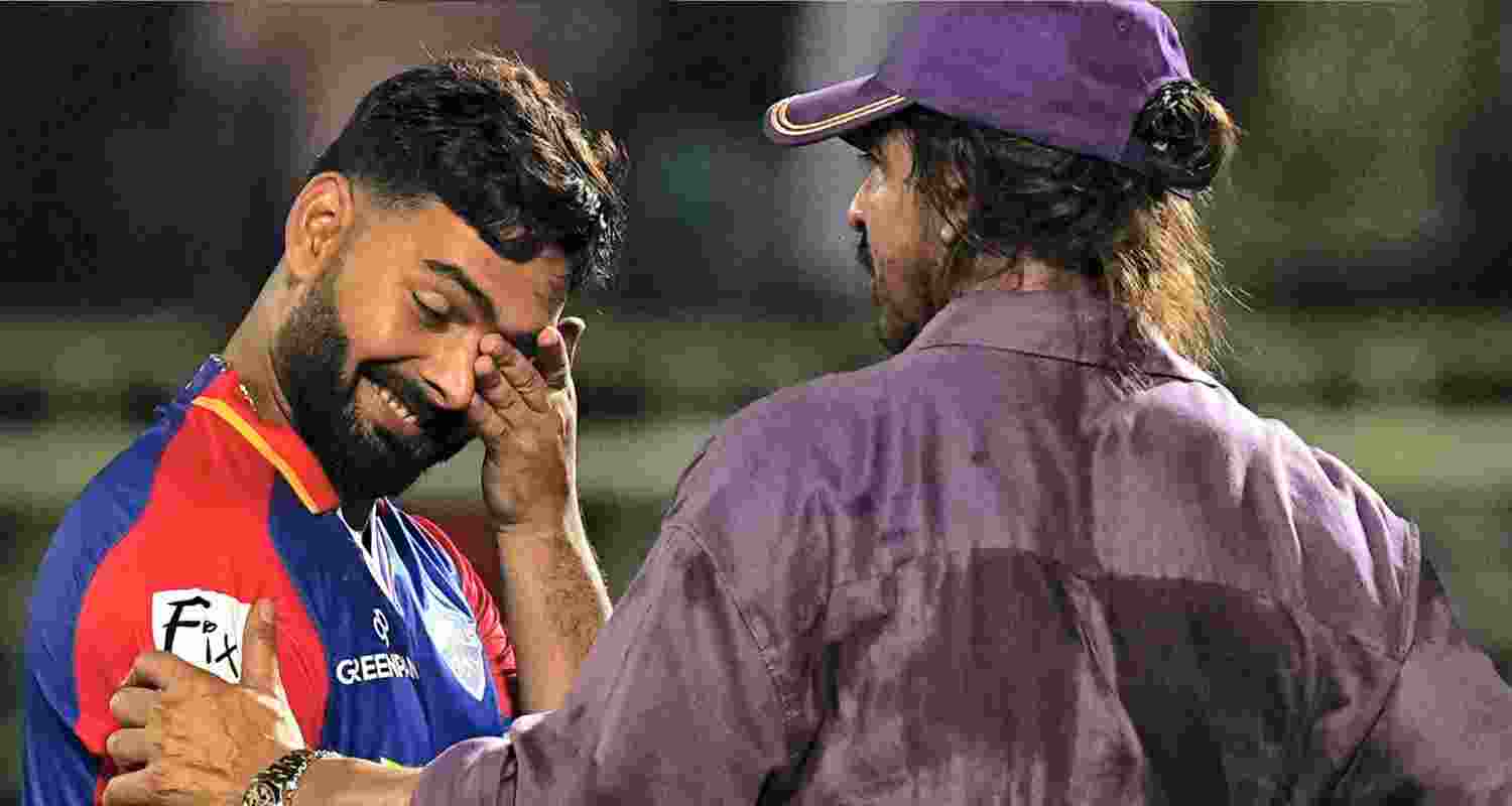 Actor and Kolkata Knight Riders's (KKR) co-owner Shah Rukh Khan greets Delhi Capitals' captain Rishabh Pant. 