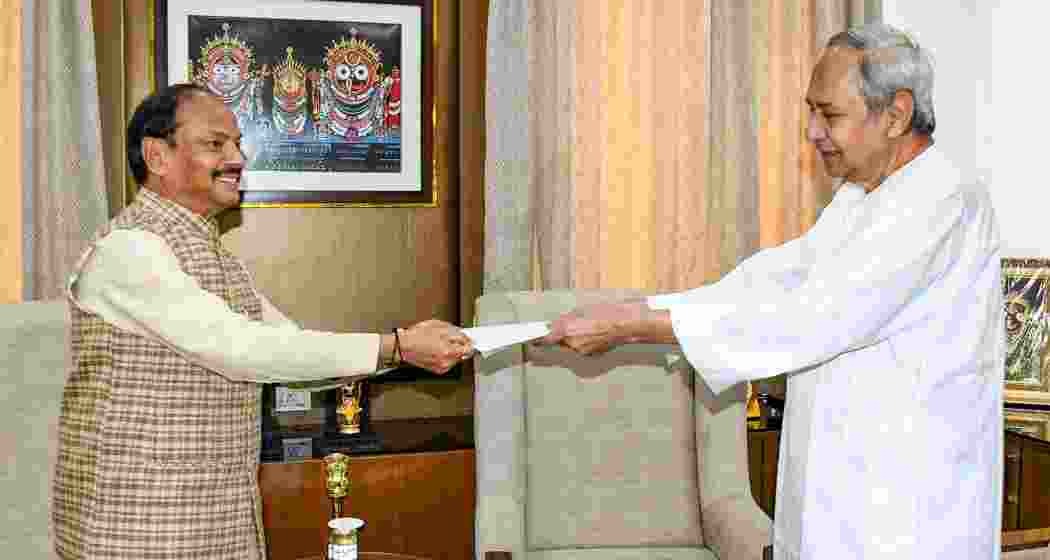 Outgoing Odisha Chief Minister Naveen Patnaik tenders his resignation letter to Governor Raghubar Das, after the defeat of his party in the state assembly elections, at Raj Bhavan, in Bhubaneswar, Wednesday, June 5, 2024. 