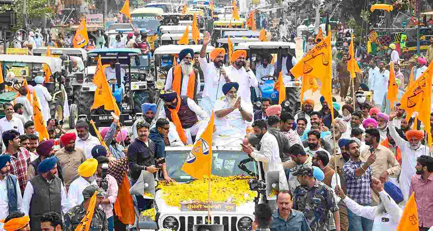 Sukhbir Singh Badal greets party followers during a rally.