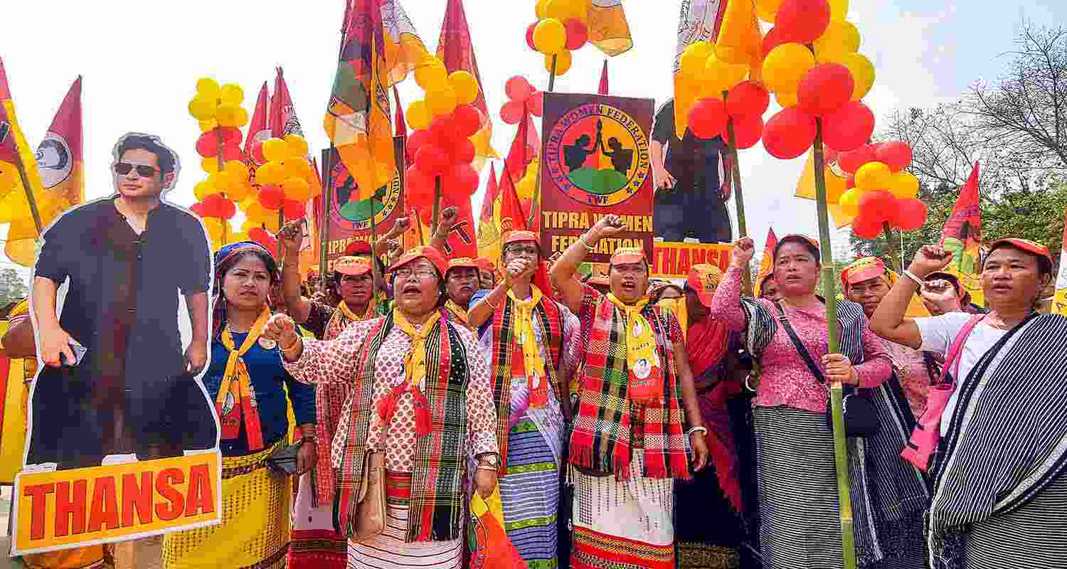 Tipra Motha Party (TMP) supporters raise slogans during NDA candidate for East Tripura Parliamentary constituency Kriti Devi Singh Deb Barman's nomination filing procession, in Agartala, Thursday.
