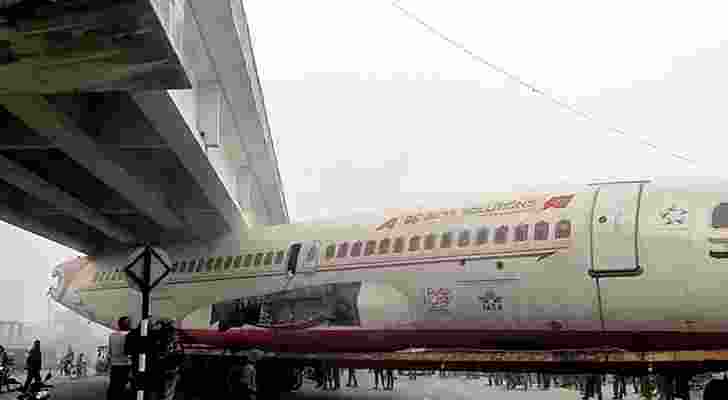 A scrapped plane transported from Lucknow to Assam on a truck got stuck beneath a bridge in Bihar