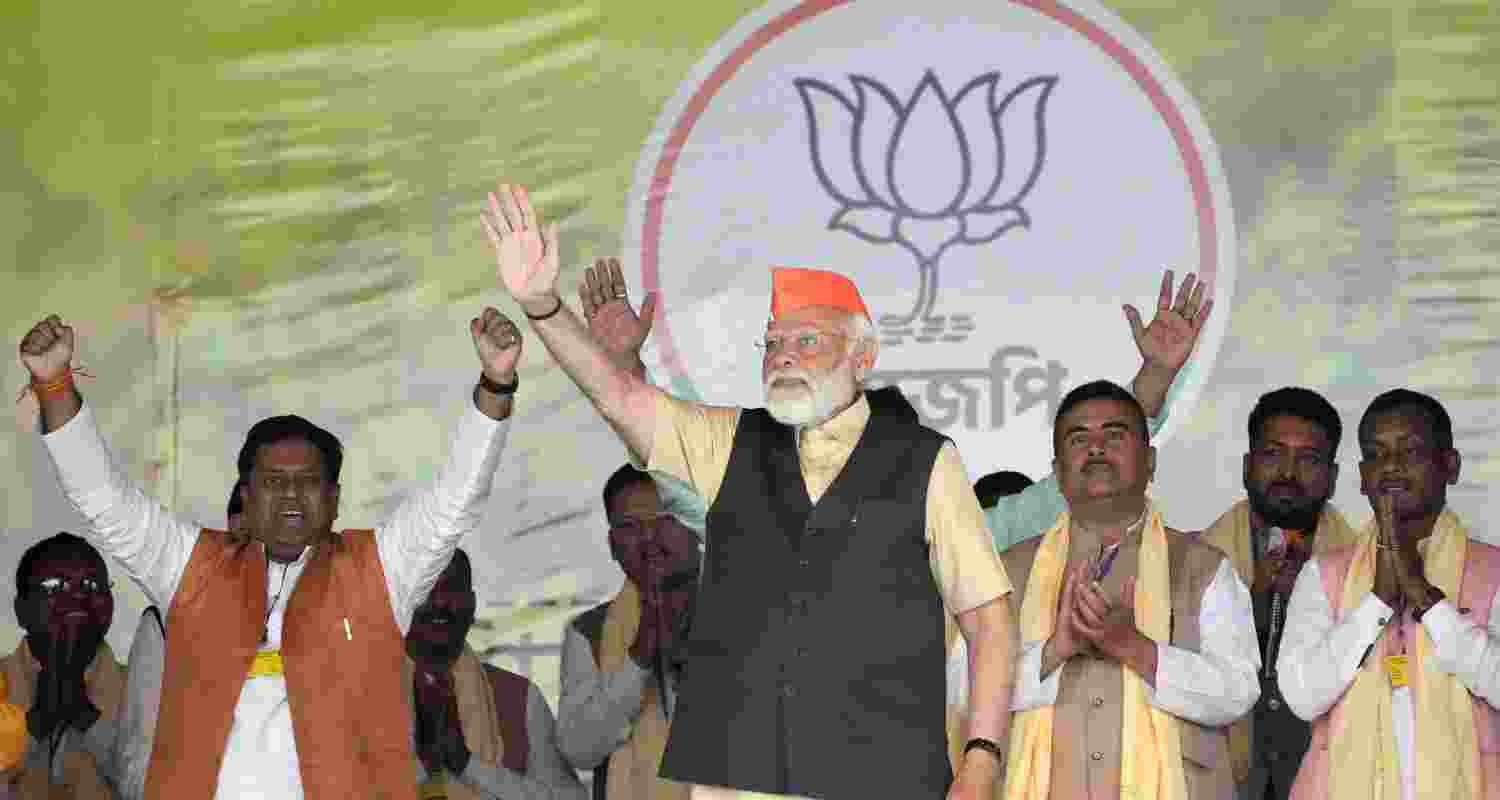 Prime Minister Narendra Modi waves during a public meeting at Kawakhali Ground in Siliguri, on Saturday.