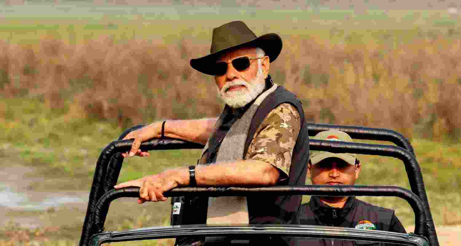 PM Modi poses for a picture while riding a jeep at Kaziranga National Park.