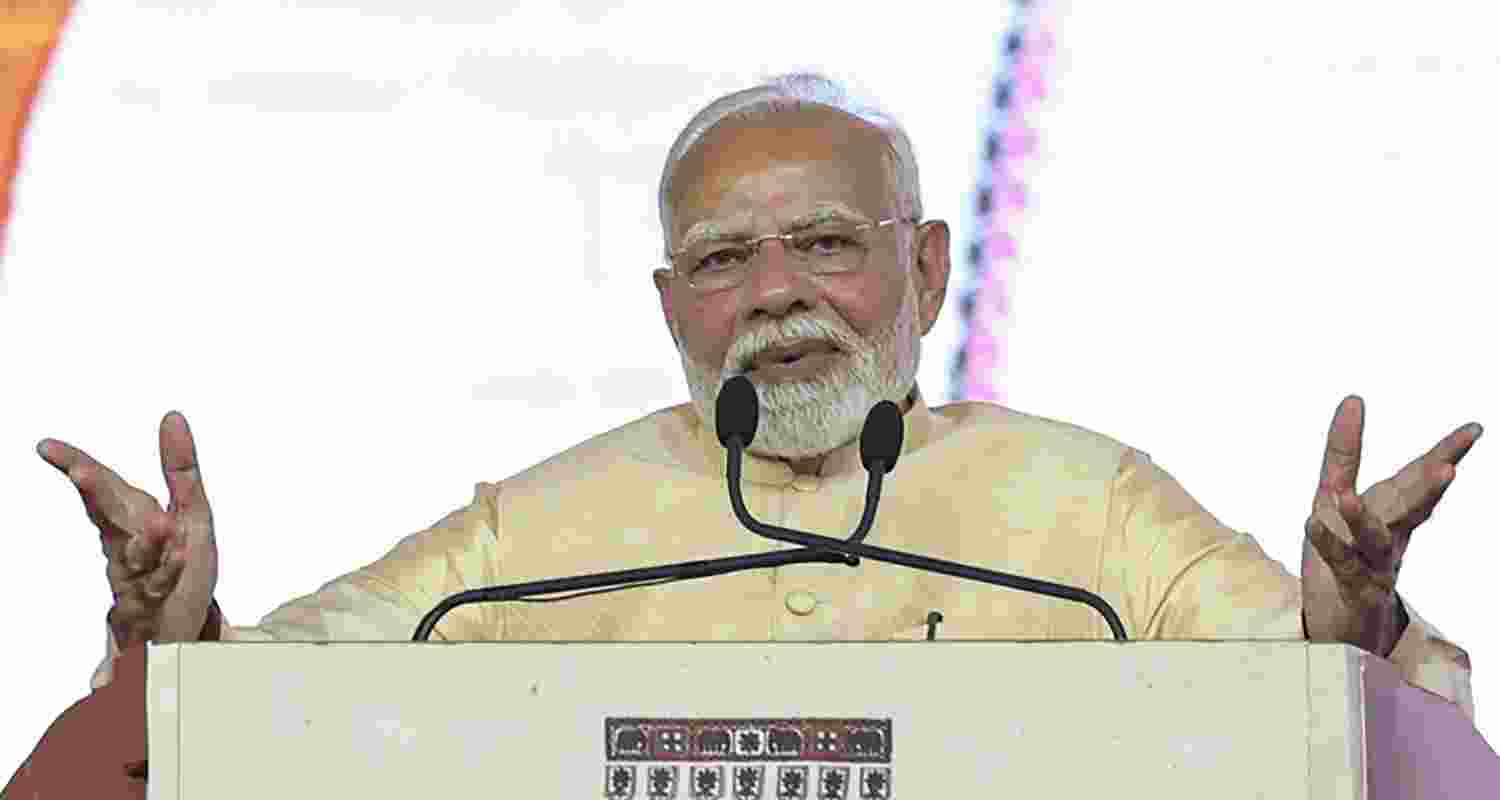 PM Narendra Modi during the foundation stone laying and inauguration of various projects, at Dudhala Amreli, Gujarat, Monday.