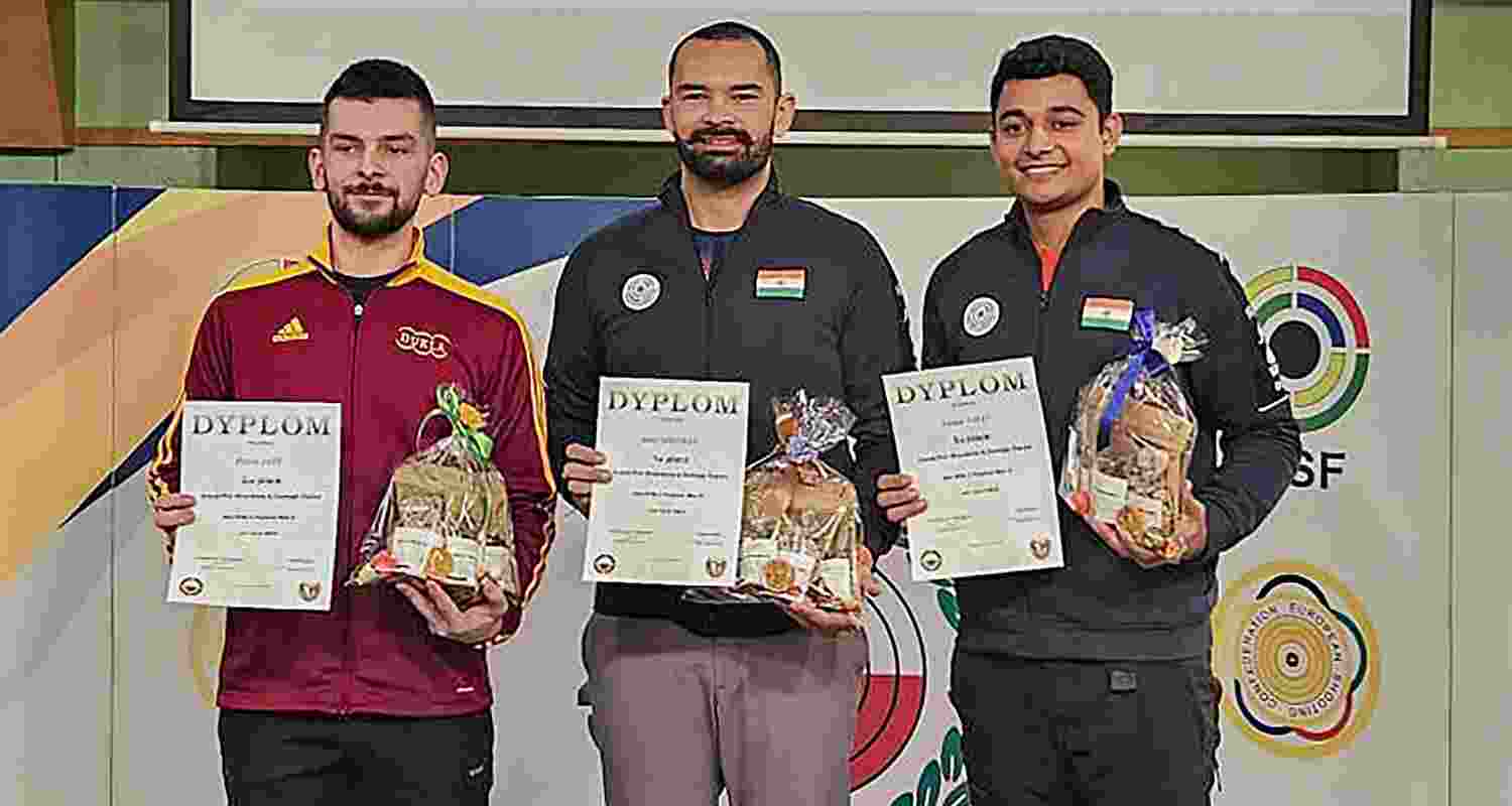 Gold medallist India's Akhil Sheoran (C), silver medallist Czech Republic's Patrik Jany (L) and bronze medallist India's Niraj Kumar pose for photographs during the presentation ceremony of the men's 50m rifle 3-positions match 2 at the Grand Prix Wroclawia & Dolnego Slaska shooting competition, in Wroclaw, Poland.