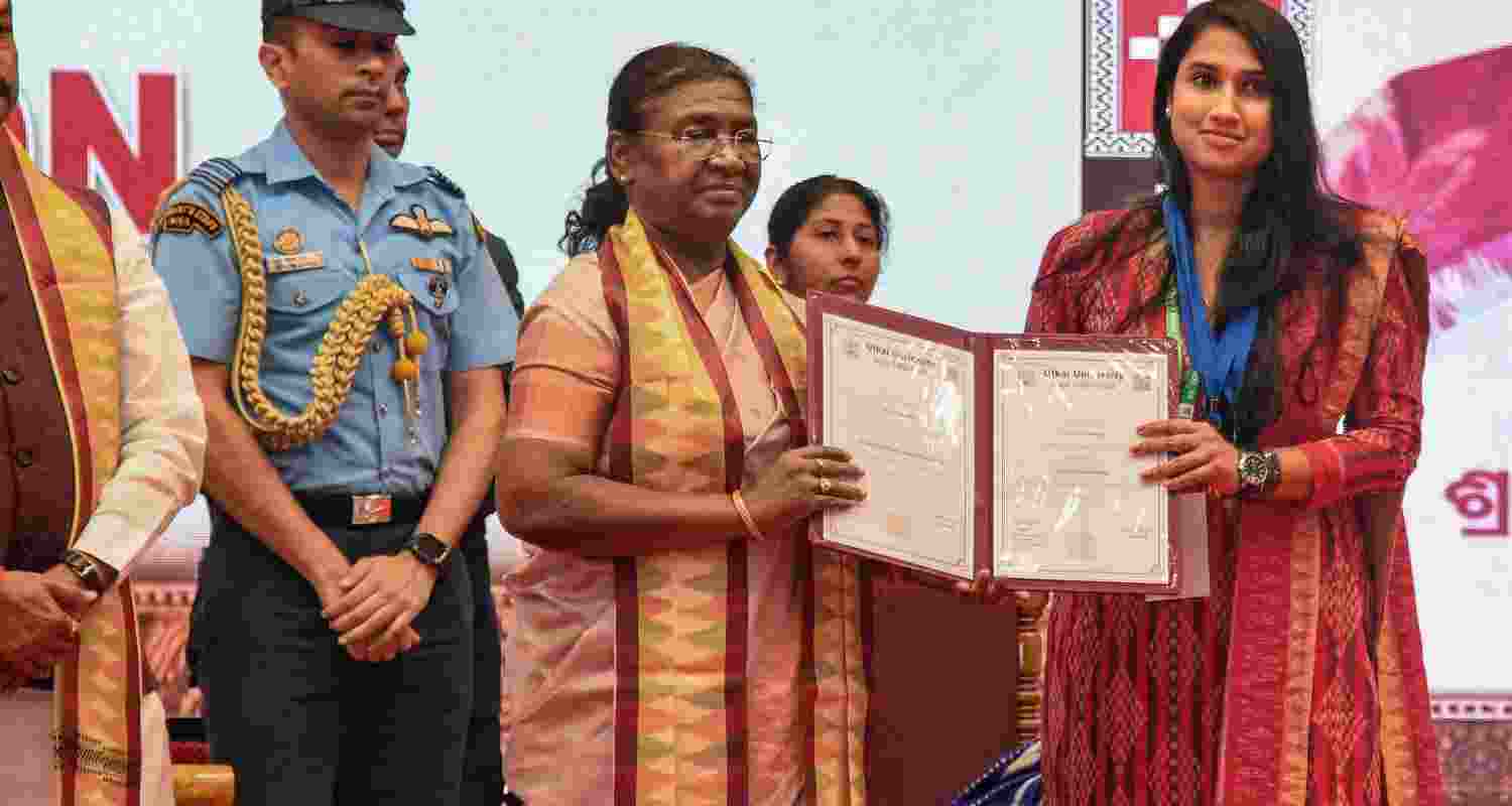 President Draupadi Murmu awards a PhD degree to a student at the Utkal University.