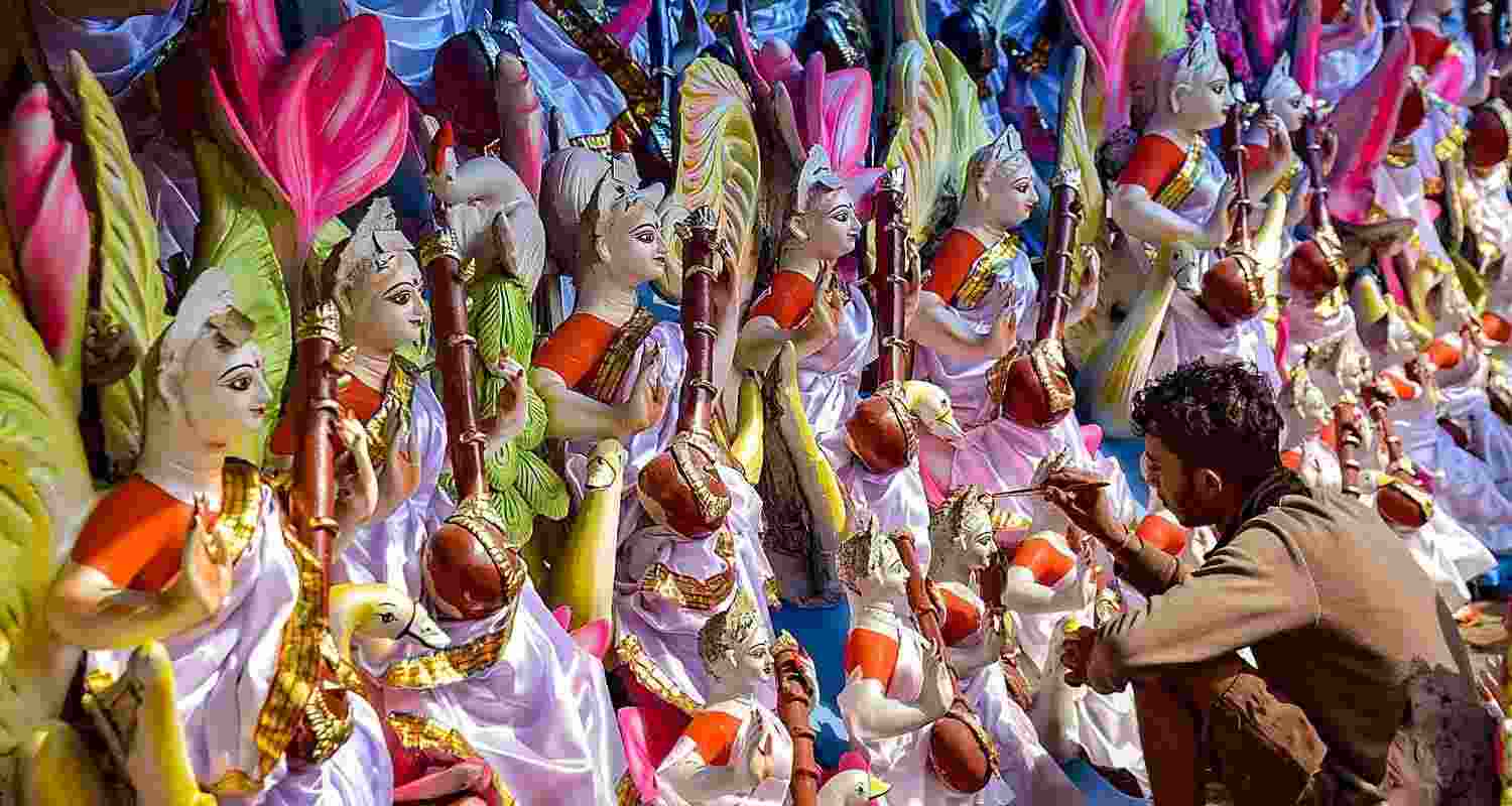 Welcoming the goddess of Knowledge: An artisan gives finishing touches to an idol of Goddess Saraswati ahead of the ‘Saraswati Puja’ festival, in Guwahati, on Tuesday.