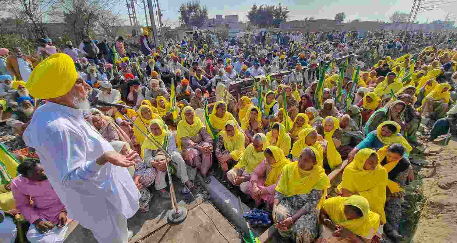 farmers dressed in yellow during a demonstration at the Shambhu border.