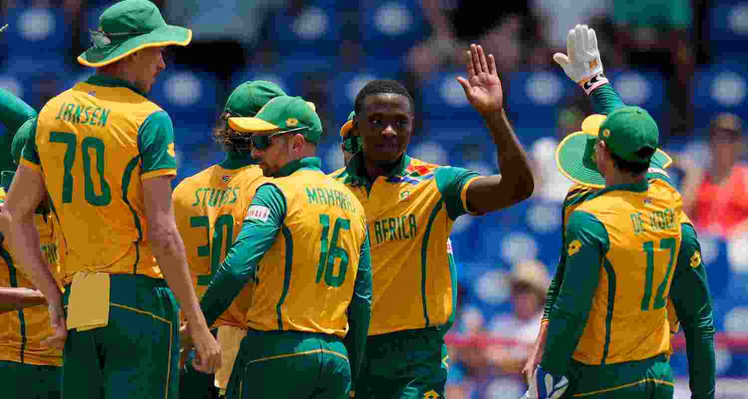 South Africa's Kagiso Rabada, second right, celebrates with teammates after the dismissal of England's Phil Salt during the ICC Men's T20 World Cup cricket match between England and South Africa at Darren Sammy National Cricket Stadium in Gros Islet, Saint Lucia, Friday, June 21, 2024.