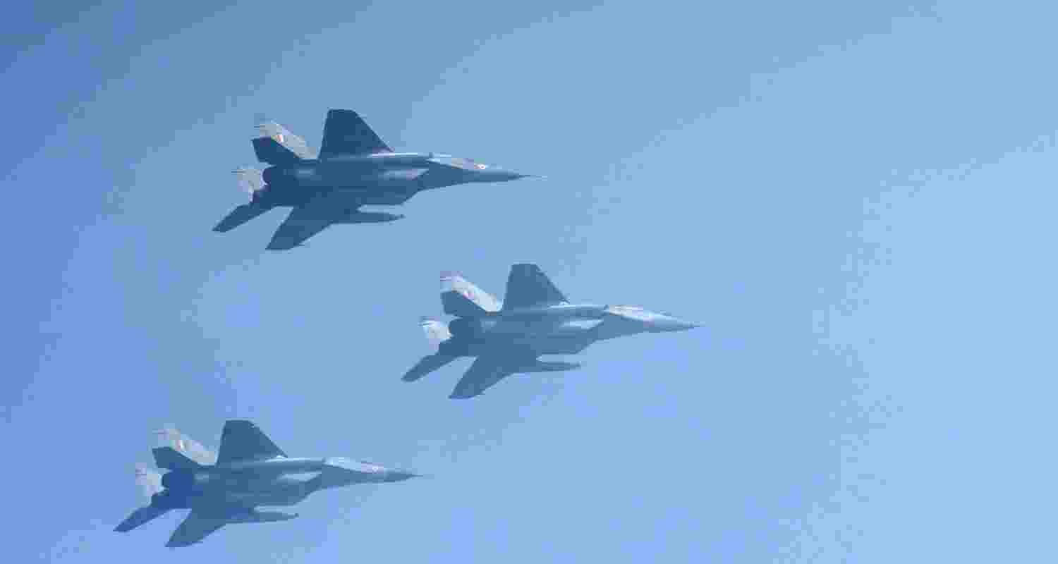 three rafale aircraft in the sky flying in formation above new Delhi, 