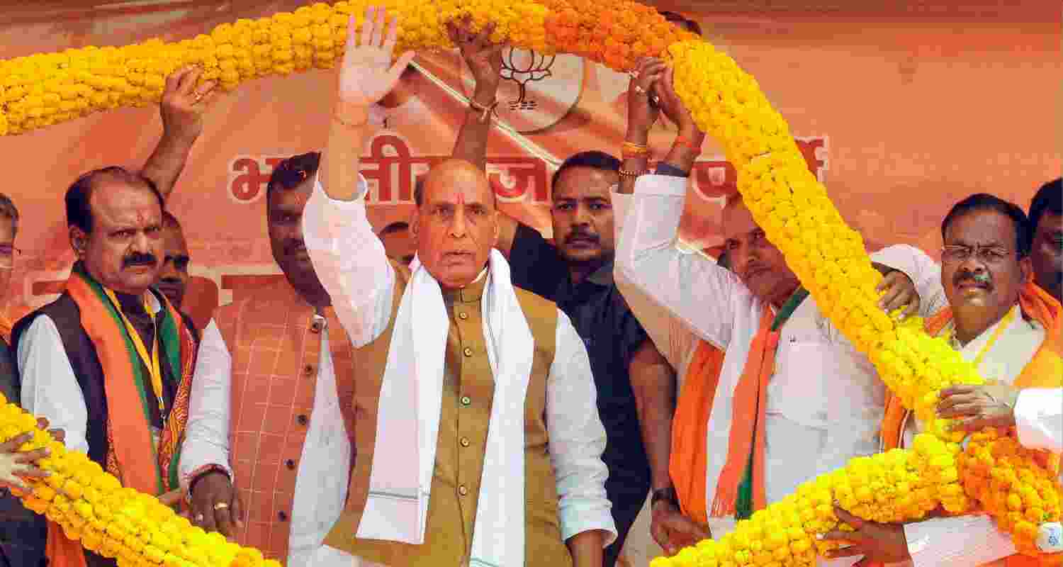Rajnath Singh waves to the crowd during rally in Jharkhand.