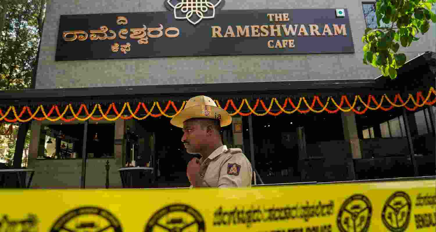A policeman stands vigilant outside the damaged premises of the Rameshwaram cafe in Bengaluru.