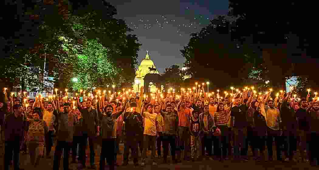 Protesters gather in front of Kolkata's iconic Victoria Memorial, demanding justice and safety for women as part of the 'Reclaim the Night' campaign.