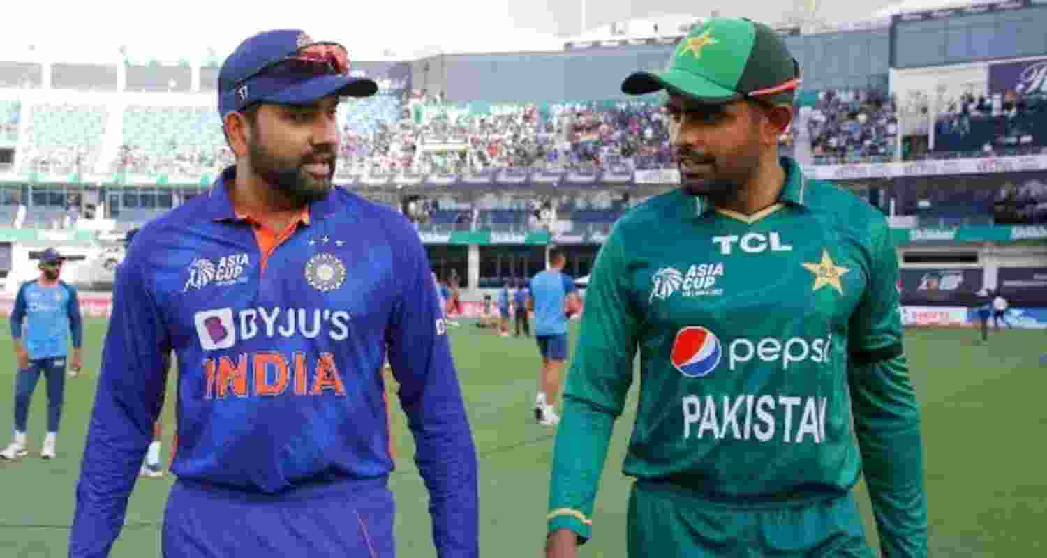 Indian skipper Rohit Sharma with former Pakistan captain Babar Azam, walking at the Wankhede stadium.
