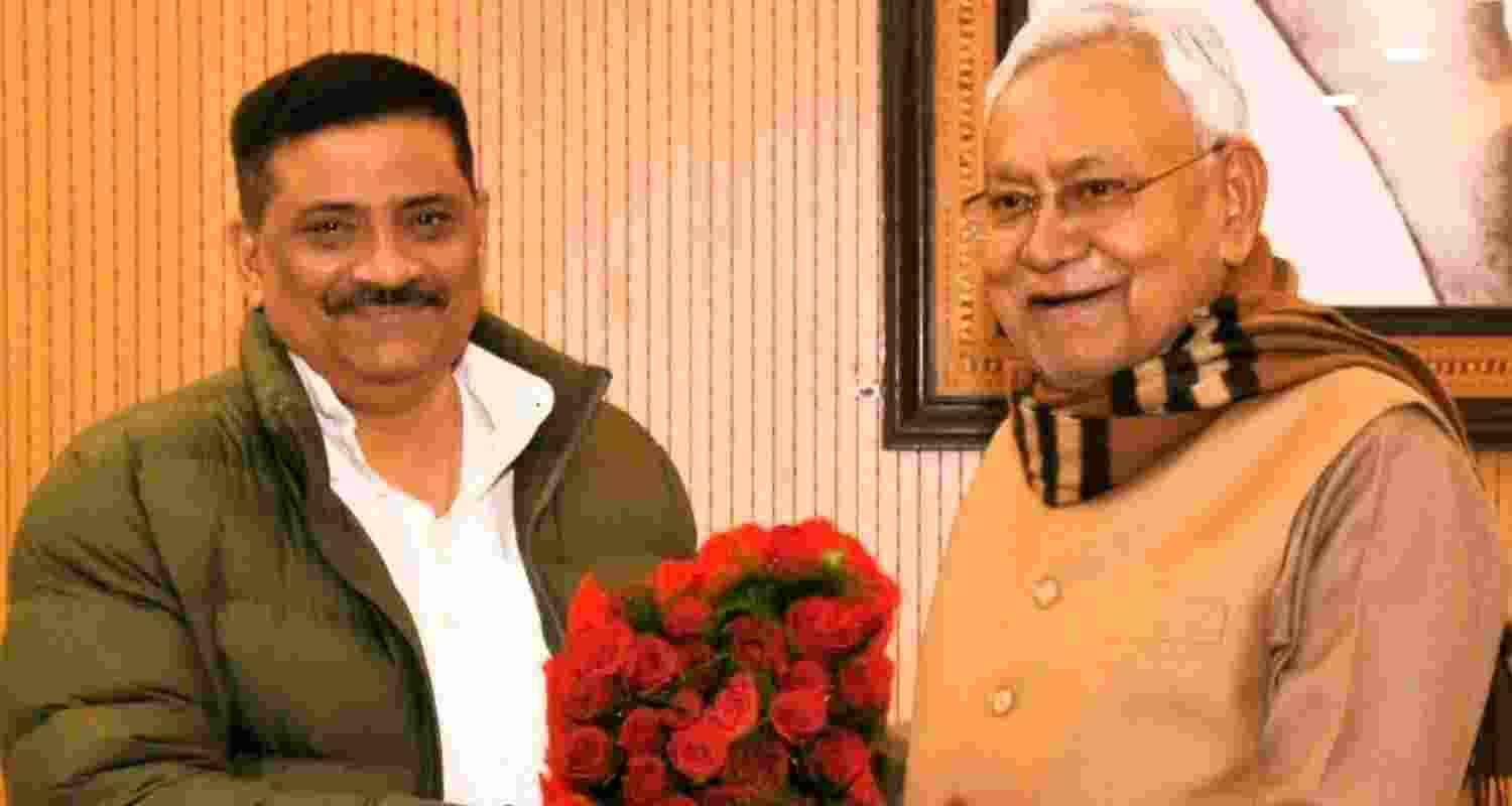 Sanjay Kumar Jha with Bihar Chief Minister Nitish Kumar. 