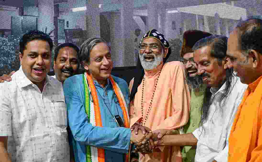 Congress Lok Sabha candidate Shashi Tharoor with Panniyan Raveendran of the CPI(M)-led LDF (second from right) at an event in Thiruvananthapuram. (PTI)
