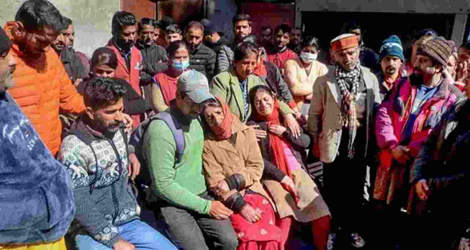 Family members of a 21-year-old boy mourn at IGMC Hospital, who was killed by an unknown person, at Mall Road in Shimla.