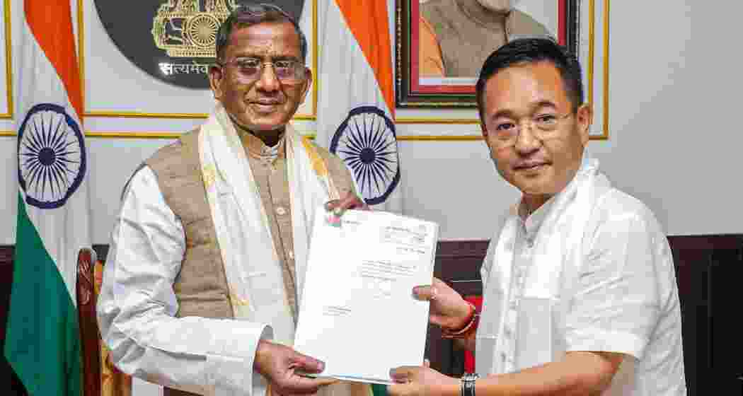 Sikkim Krantikari Morcha (SKM) leader Prem Singh Tamang meets State Governor Lakshman Prasad Acharya to stake claim to form the government in the state at Raj Bhavan, in Gangtok, Sikkim on Monday.