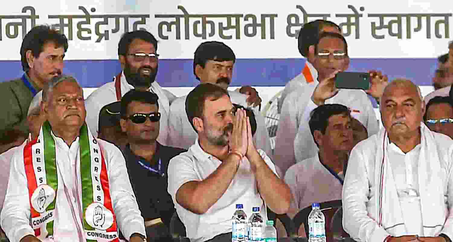 Congress leader and candidate from Rae Bareli constituency Rahul Gandhi with former Haryana chief minister Bhupinder Singh Hooda and others during a public meeting for the Lok Sabha elections, in Mahendragarh, Wednesday. 