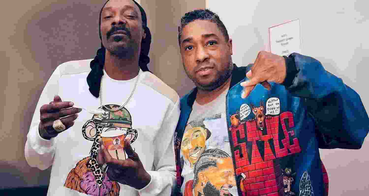 Snoop Dogg poses for a picture with Bing Worthington.