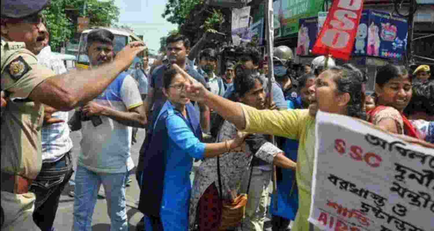 West Bengal Police personnel try to reason with members of the All India Democratic Youth Organisation (AIDYO) and All India Democratic Students' Organisation (AIDSO) during their protest march towards Chief Minister Mamata Banerjee's residence over state ministers' involvement in the SSC recruitment scam in Kolkata in the year 2022.