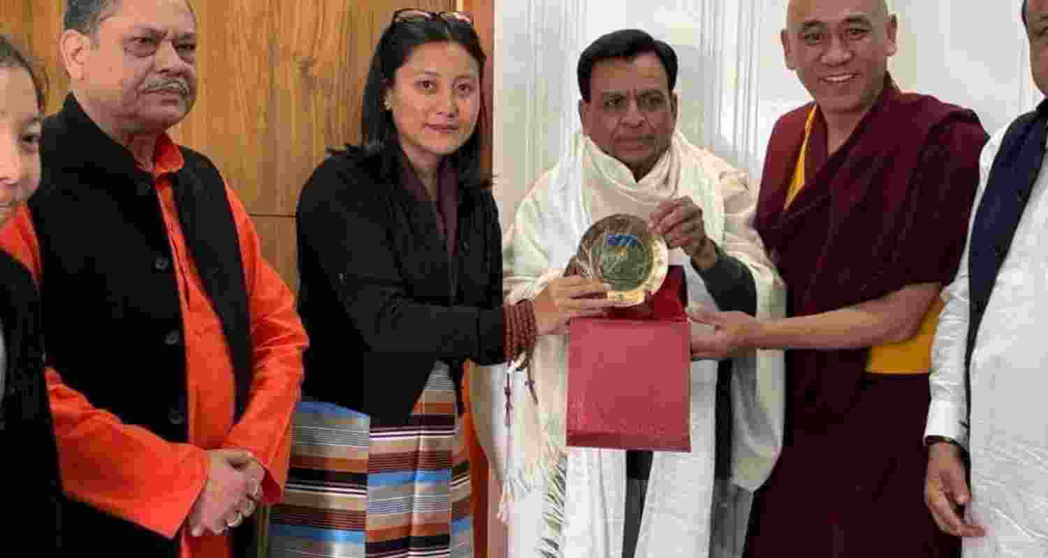 Tibetan MP in exile Tenzin Choezin hands a memento during the India-Tibet friendship meet, India Tibet Friendship forum in Bhopal, Indore, Madhya Pradesh