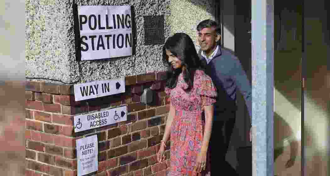 Britain's Prime Minister Rishi Sunak and his wife Akshata Murty arrive at a polling station to cast their votes near Richmond, North Yorkshire, England.. 