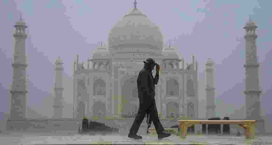 Iconic Taj Mahal stands tall amidst heavy rain.