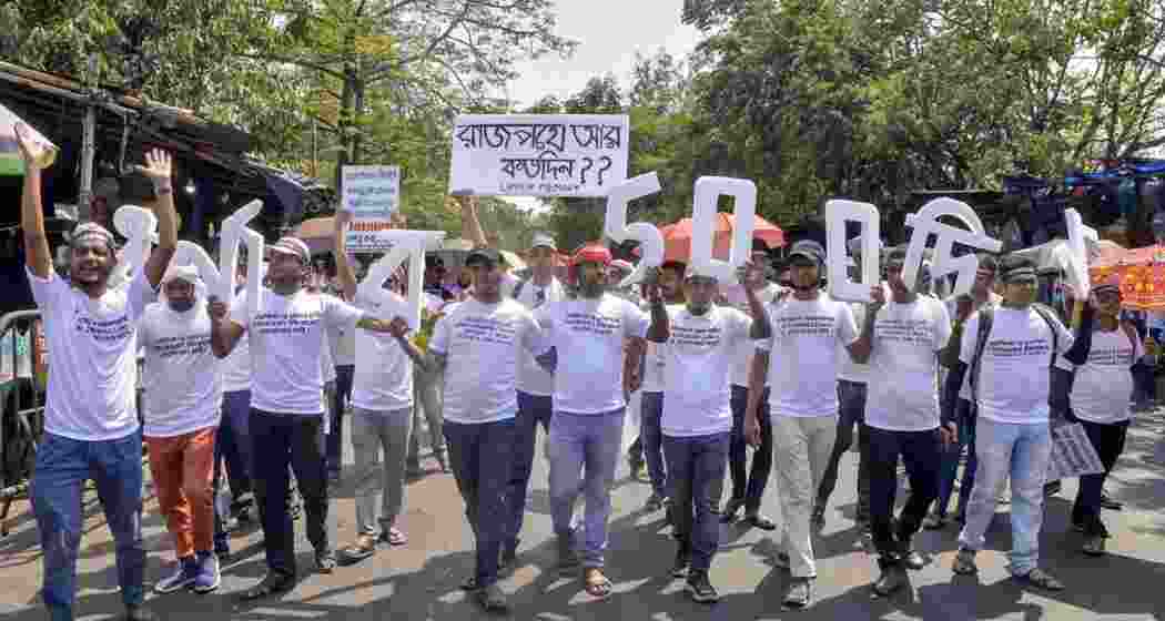 Upper Primary (2016) job aspirants take out the protest rally demanding their recruitment, in Kolkata on Wednesday.