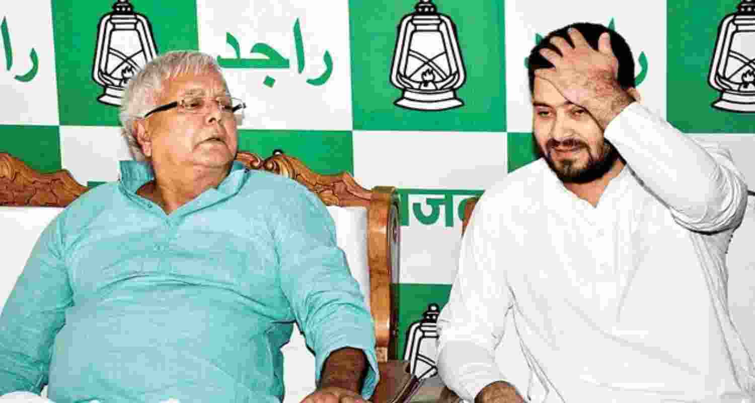 Former Bihar Chief Minister Lalu Prasad Yadav along with son and former Bihar Deputy Chief Minister Tejashwi Yadav.