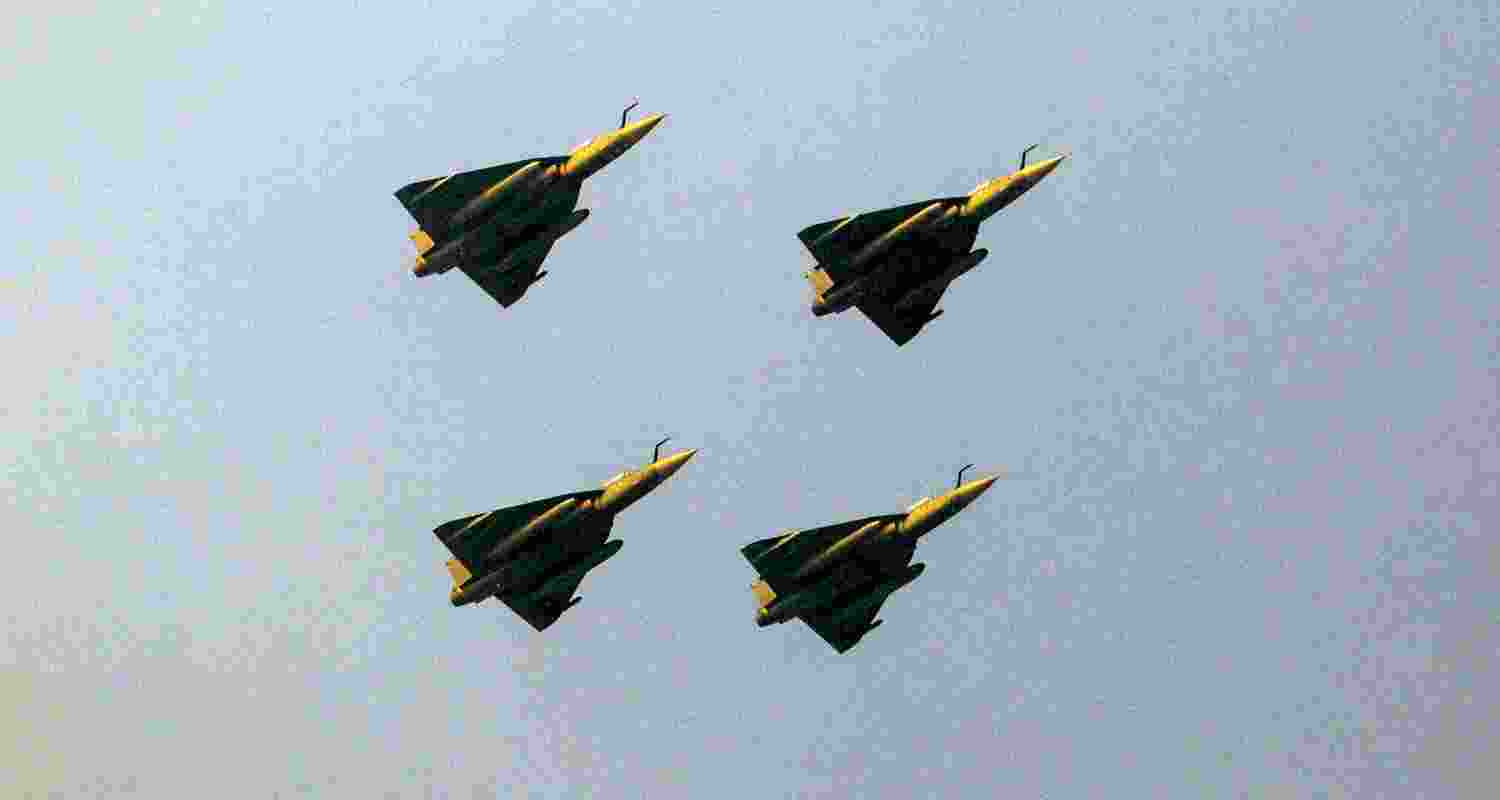 4 Tejas aircraft flying in a closed formation.