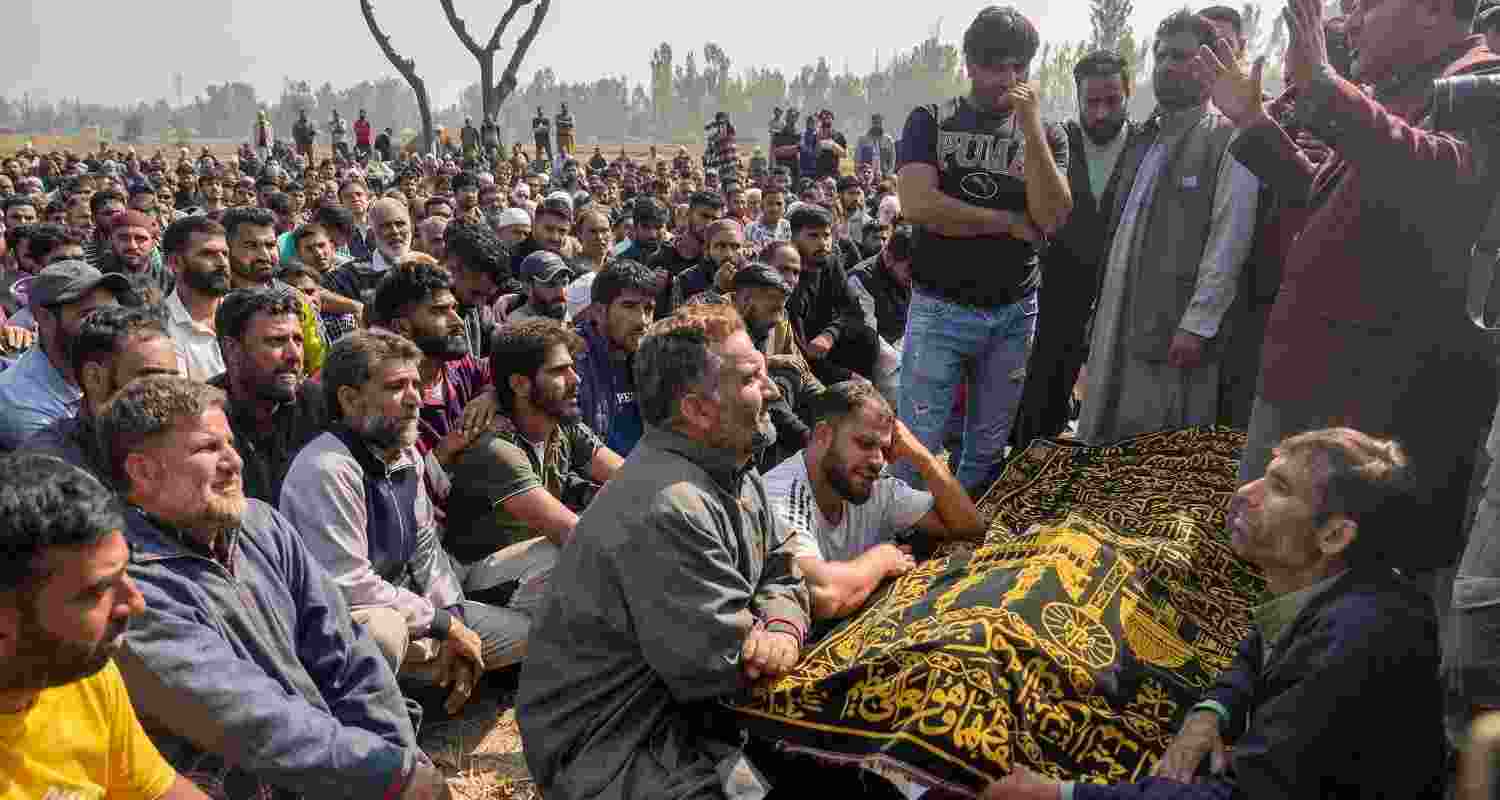 Family members of Dr Shahnawaz, who was killed in the Sonmarg terror attack, along with his body as his final rites are being read.