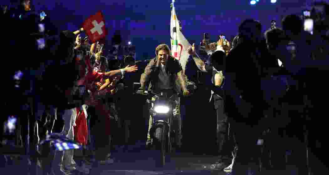 Tom Cruise takes center stage at the Paris Olympics closing ceremony, transferring the Olympic flag to Los Angeles in a dramatic Mission Impossible-style stunt.