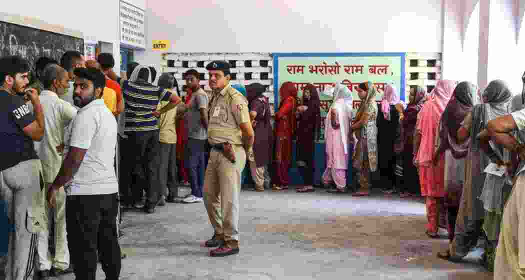 Haryana assembly elections: Voters in queues to cast their vote at a polling station in Panchkula on Saturday.