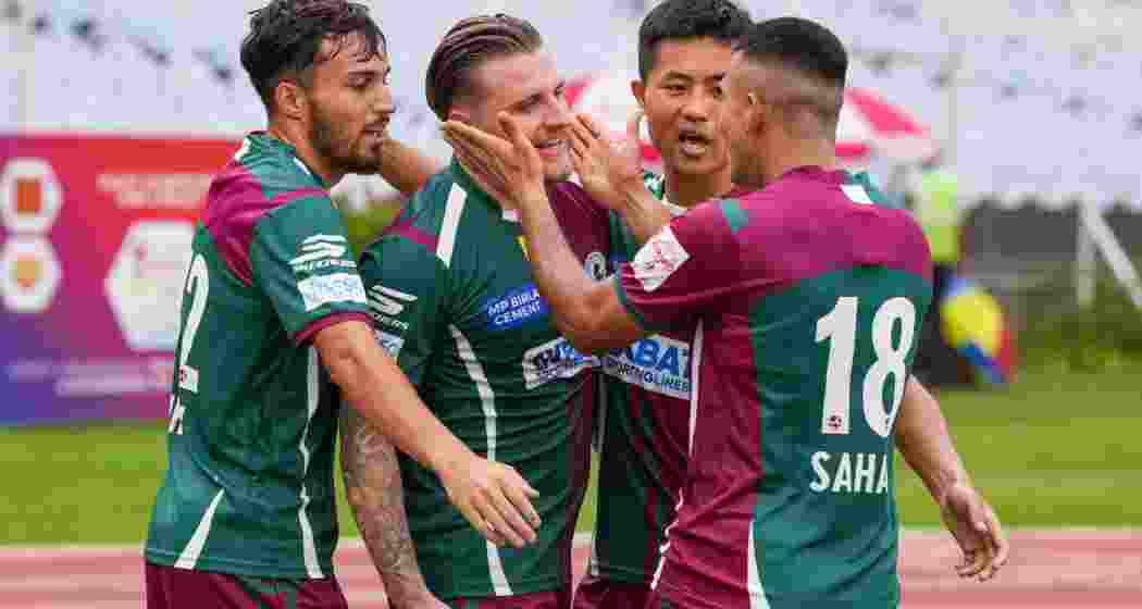 Jason Steven Cummings (35) of Mohun Bagan SG celebrates with teammates after scoring a goal during the 2024 Durand Cup football match between Mohun Bagan SG and Indian Air Force, at VYBK stadium in Kolkata, Thursday, Aug. 8, 2024