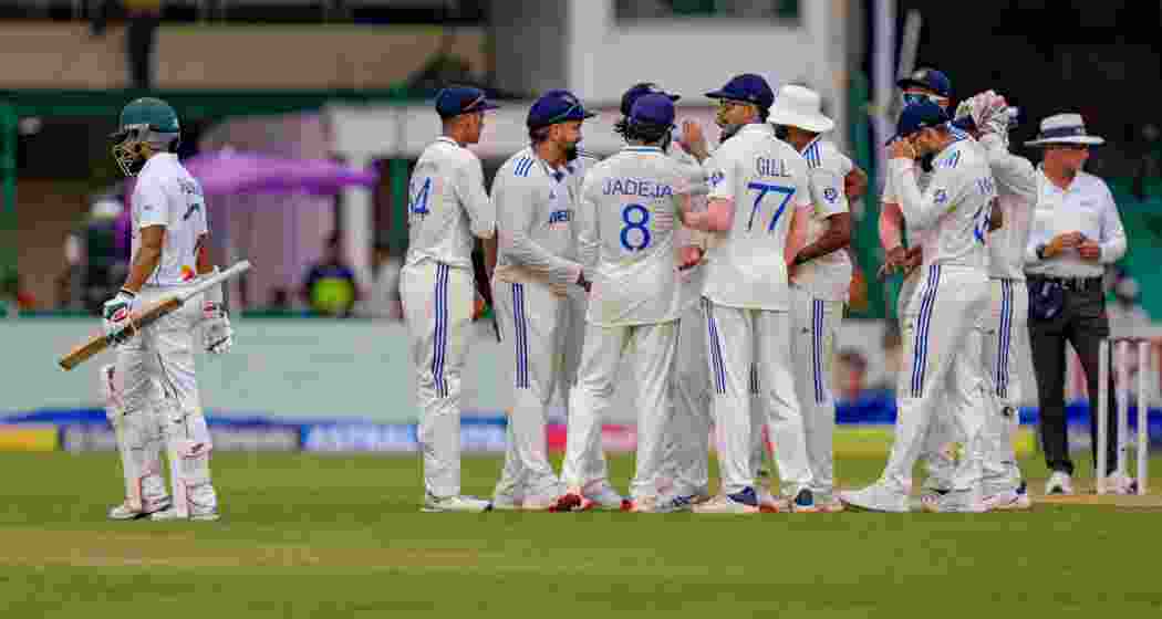 India's Akash Deep with teammates celebrates the wicket of Shadman Islam during the first day of the 2nd cricket Test match between India and Bangladesh at the Green Park Stadium, in Kanpur, Friday, Sept. 27, 2024.