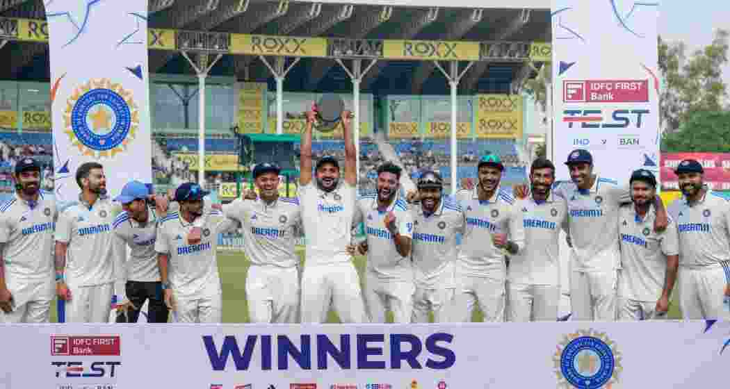 India's Jasprit Bumrah celebrates with teammates after taking the wicket of Bangladesh's Mehidy Hasan Miraz on the fifth day of the second test cricket match between India and Bangladesh, at the Green Park stadium, in Kanpur, Tuesday, Oct. 1, 2024.