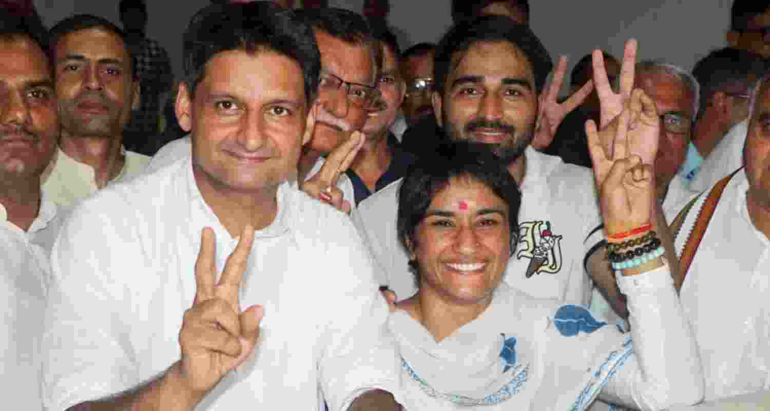 Congress leader Deepender Hooda, former wrestler and Congress candidate from Julana constituency Vinesh Phogat, her husband and wrestler Somvir Rathee and others during her nomination filing for the upcoming Haryana Assembly elections, in Jind district, Wednesday. 