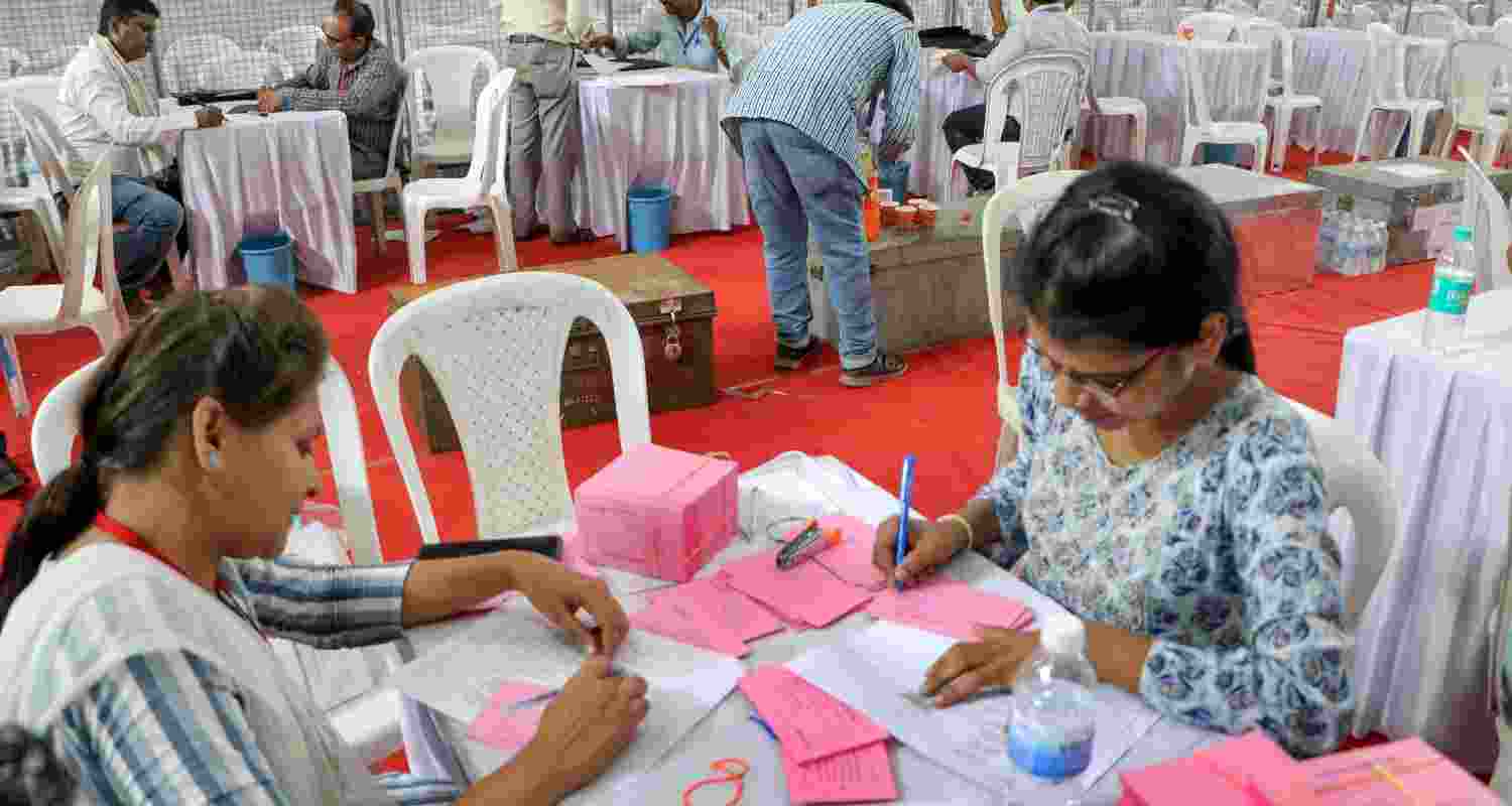  Polling officials carry out preparations at a counting centre, a day before counting of votes for the Lok Sabha elections, in Nagpur, Monday, June 3, 2024. 
