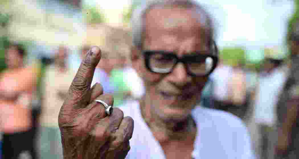 A senior elector proudly showcasing his inked finger after casting his vote in Phase 7 of the Lok Sabha Election at 109 Khardaha AC under 16 Dum Dum PC of North 24 Parganas district, West Bengal.