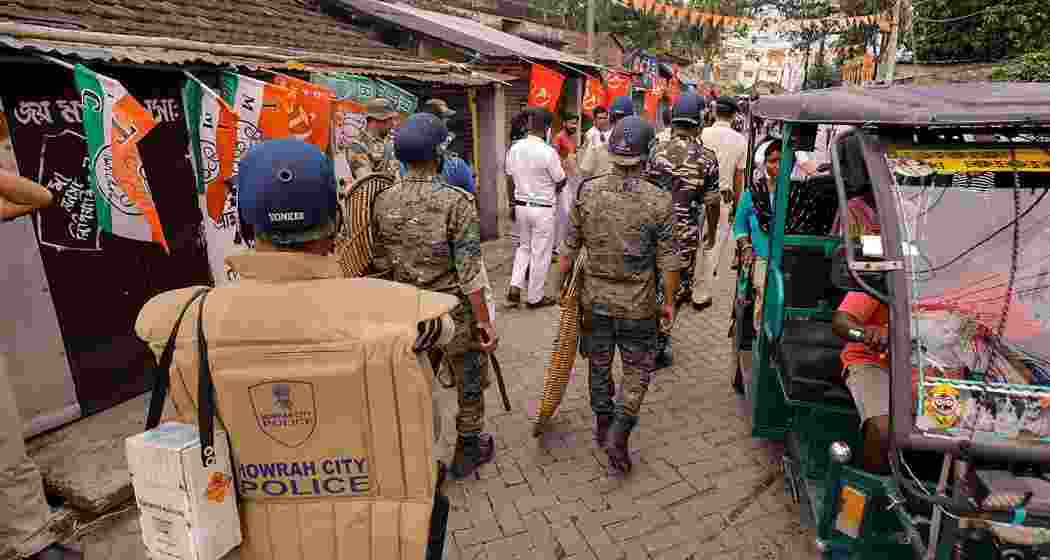  Security personnel patrol near a polling booth after clash between BJP and TMC workers, in Howrah, Monday, May 20, 2024.