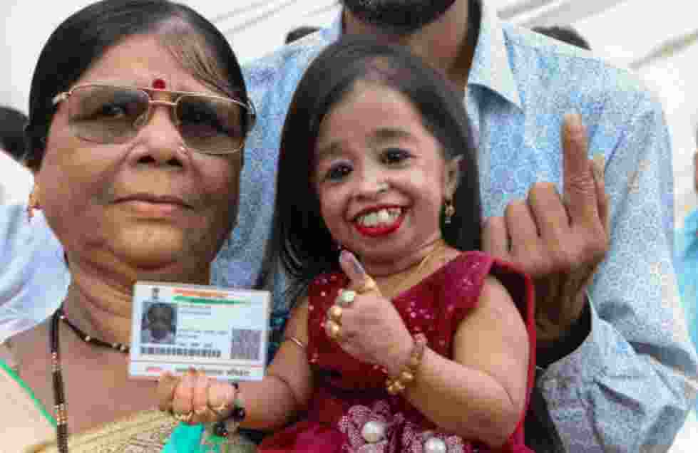 Jyoti Amge, recognized by Guinness World Records as the world's shortest woman, exercised her right to vote at a polling booth in Nagpur.